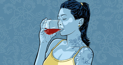Tattooed woman drinking alcohol for alcohol tattoo article