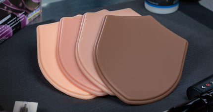 Array of tattooable Micro series tattooable shields by A Pound of Flesh in 4 Fitzpatrick skin tones
