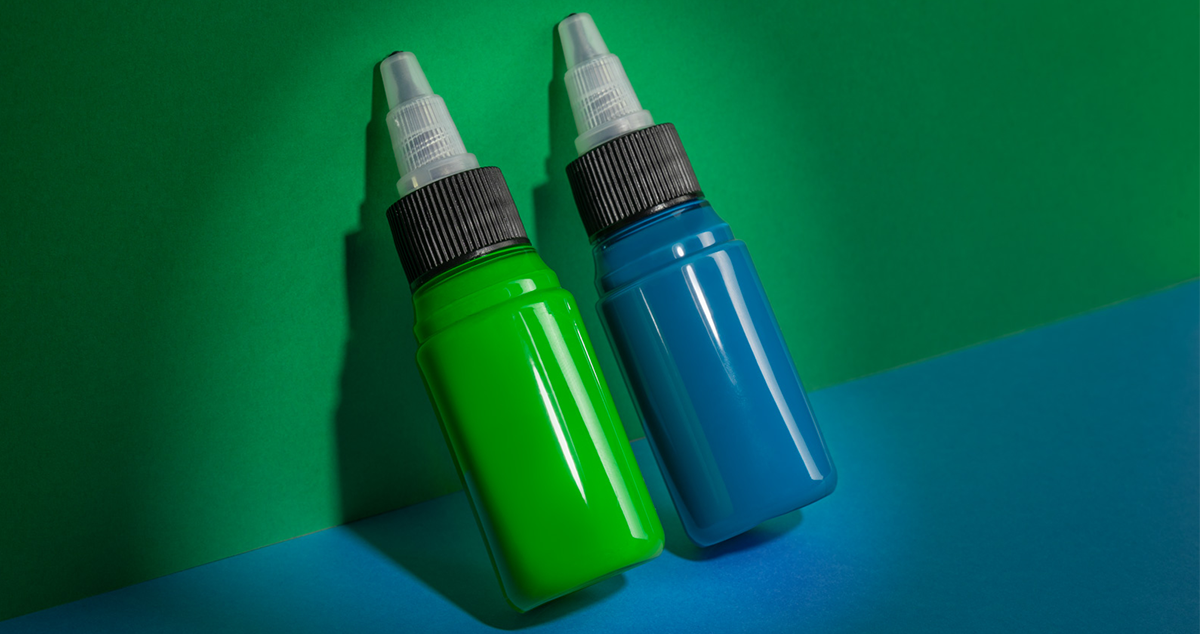 Two bottles of blue and green tattoo inks containing blue 15:3 and green 7 pigments Save the Pigments: EU Ban on Blue 15:3 and Green 7