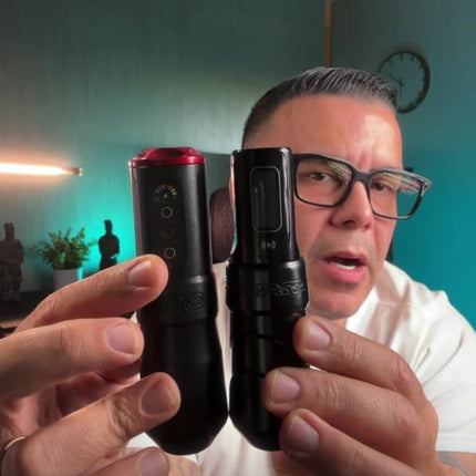 Gaston Siciliano holding up ONE and Flux Max tattoo machines