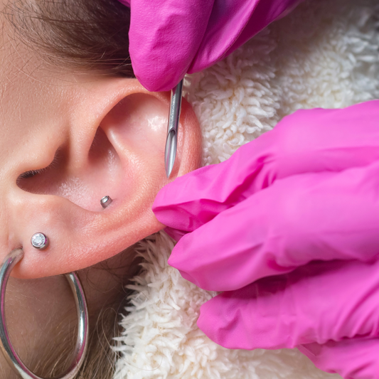 Close-up of piercing process
