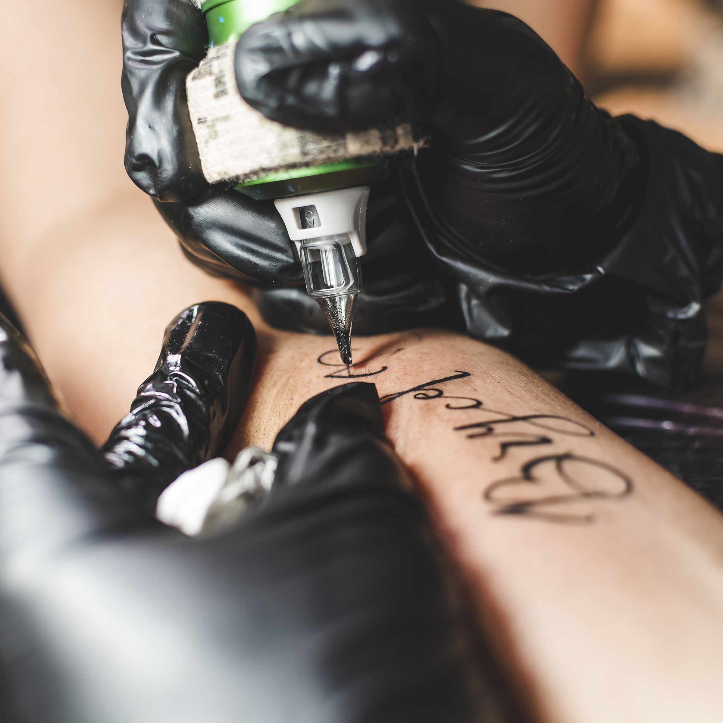Script tattoo in action Tattoo Lettering for Beginners