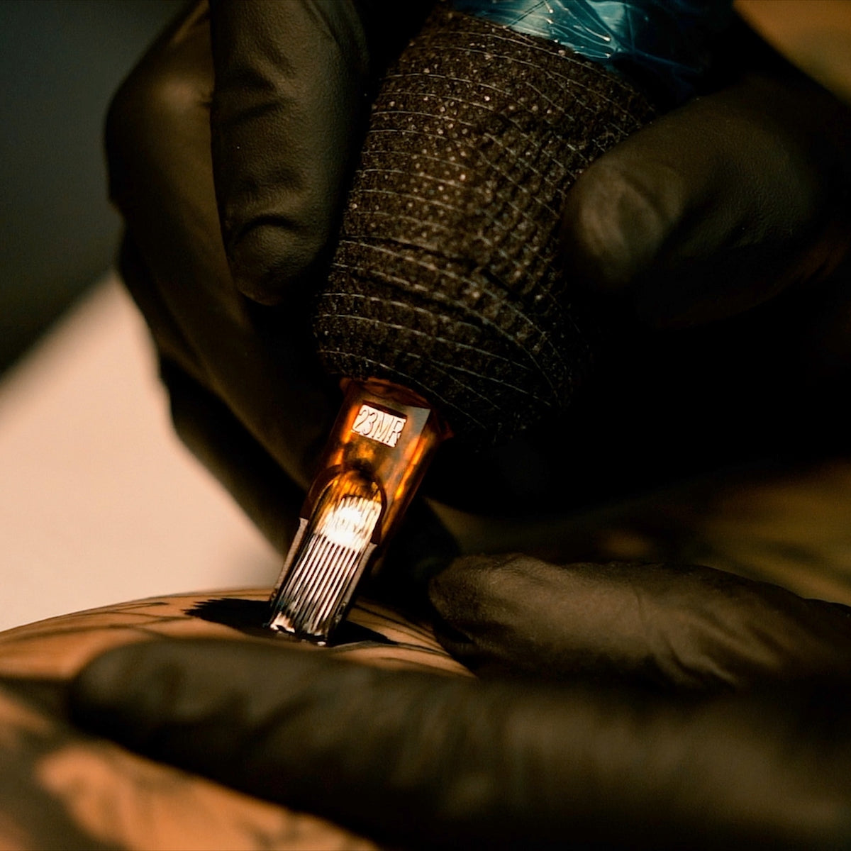 Close-up of Triton needles tattooing a client VIDEO: Real Artists, Real Reviews: PEAK Triton Needles with Tattoo artist John Garancheski