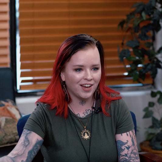 Still of tattoo artist Casey Hart giving an interview on time management