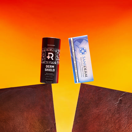 Roll of Recovery Derm Shield and Box of Saniderm facing off with orange and yellow backdrop