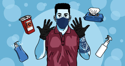 Tattoo artist with latex gloves and other essential PPE