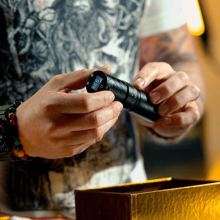 Close up of artist holding a Peak machine