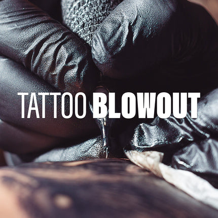 An artist tattooing a client.