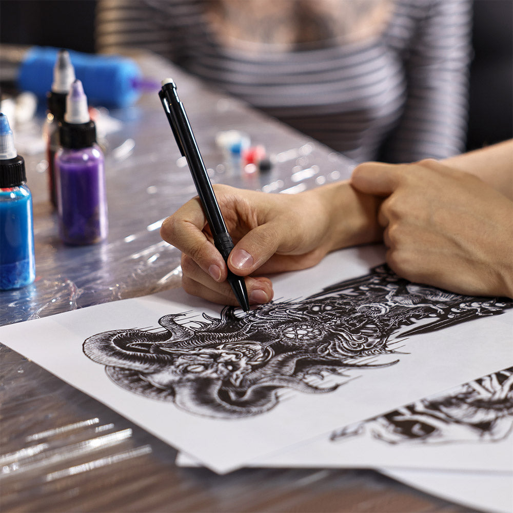 Artist completing work for porfolio. Creating Your Tattoo Portfolio