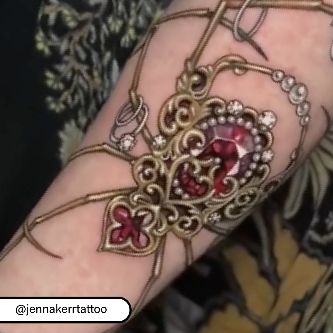 Red jewel spider tattoo by Jenna Kerr How to Do Jewel Tattoos, Your Complete Guide