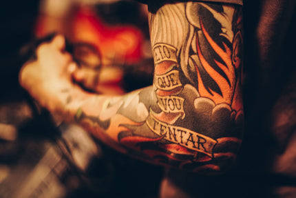 close up shot of sleeve tattoo taken by Matheus Ferrero via Unsplash