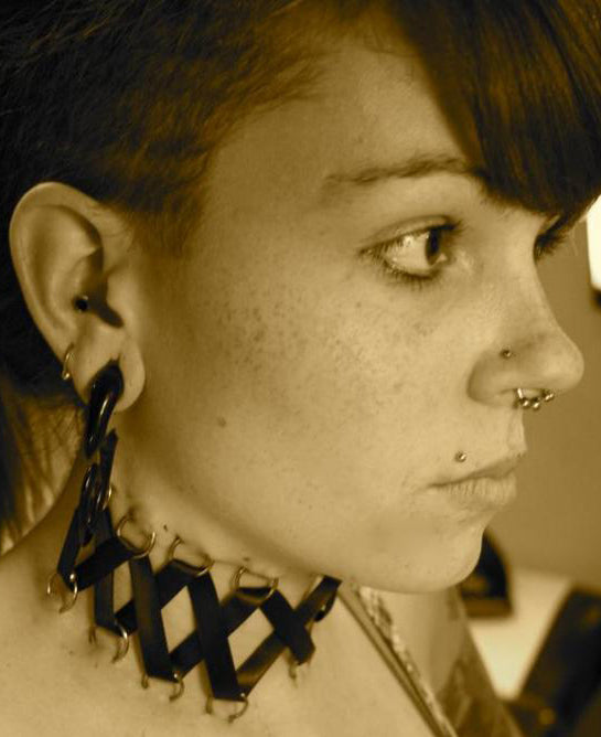 Photo of a Woman With a Septum Piercing and Other Piercings, From the Painful Pleasures Gallery