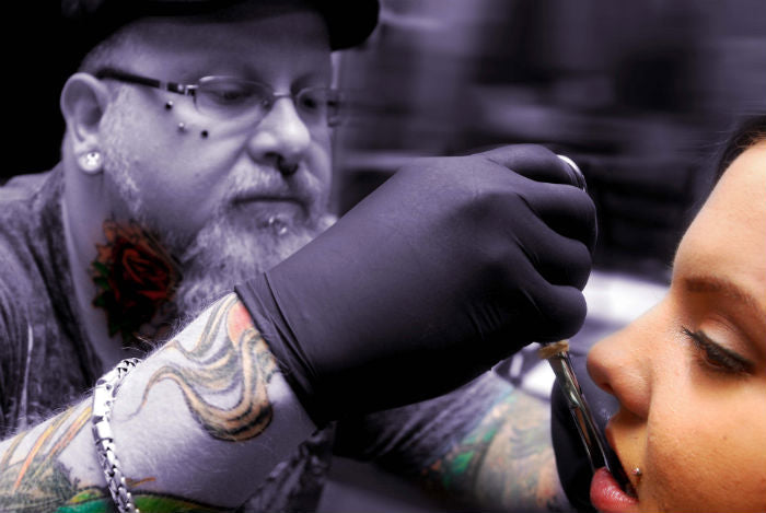 Lip Piercing in Progress - Photo Compliments of Typesofpiercings.net Piercing Techniques