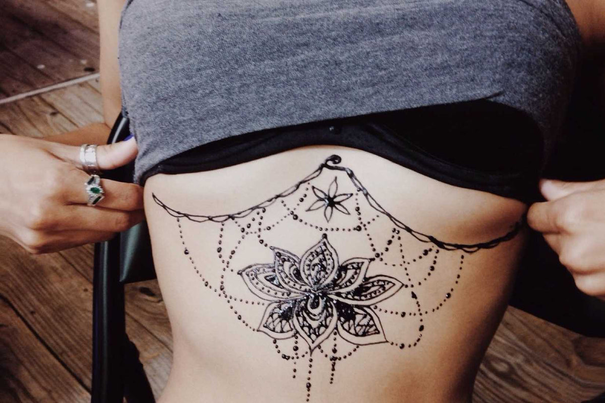 underboob tattoo, sternum tattoo