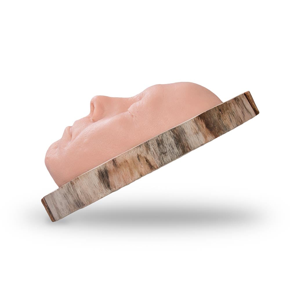 A Pound of Flesh Tattooable Idol Face on Wooden Plank — Front Angled View
