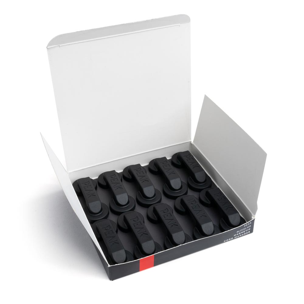 Single Peak Magnetic Cord Manager shown on white surface from the bottom front