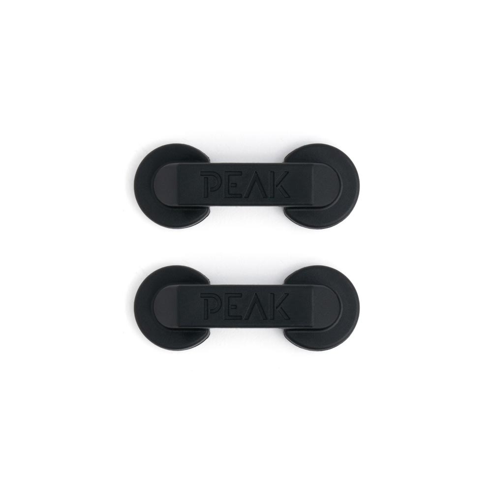 Example of Peak Magnetic Cord Manager holding cords on white background