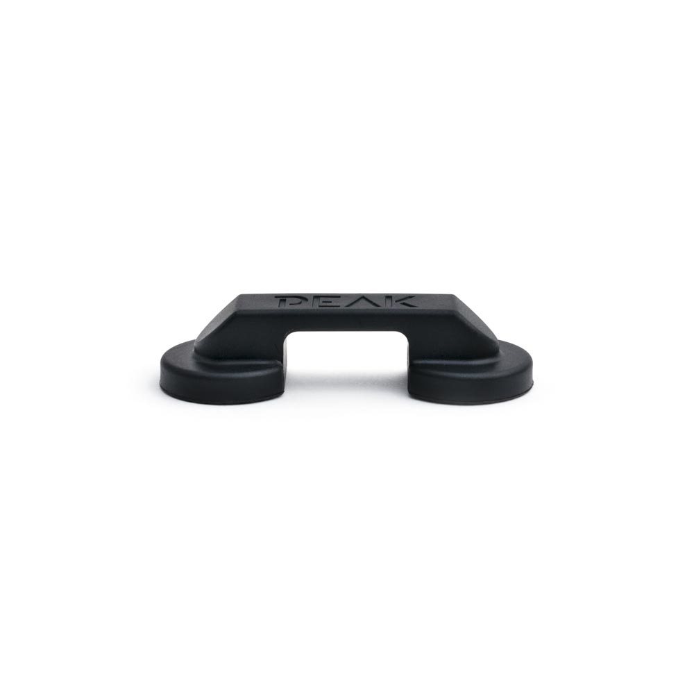 One box of Peak Magnetic Cord Managers shown with two cord managers out of box on white background