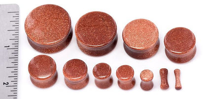 Red Glass Double Flare Plugs Crafted From Glittering Goldstone