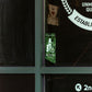 Recovery Sold Here Window Cling with Leaves Background on Display