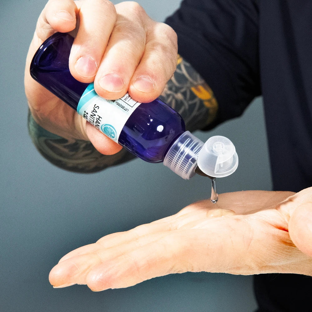 World Famous Hand Sanitizer — 2oz Bottle (in use)