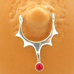 Place the nipple shield over your nipple, lining the holes up with your piercing holes.
