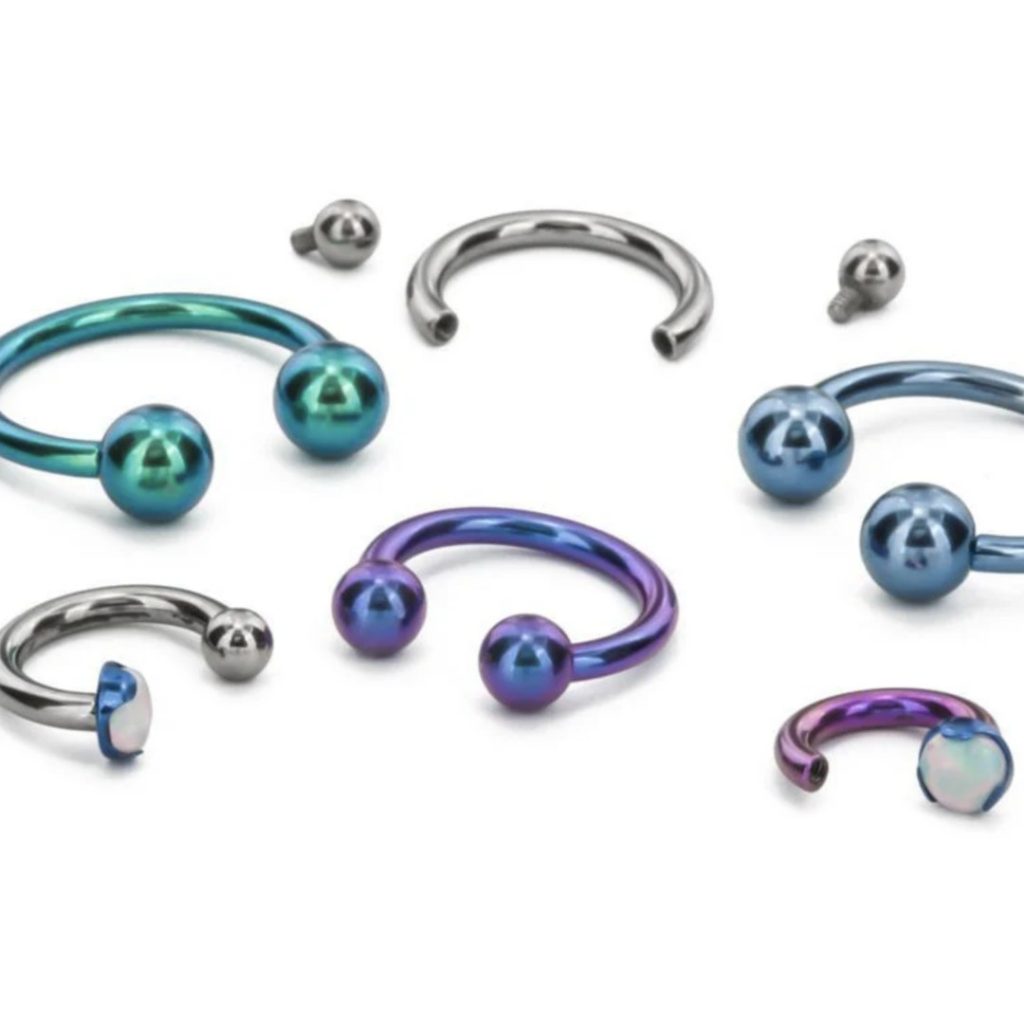 A group of curved barbell rings.