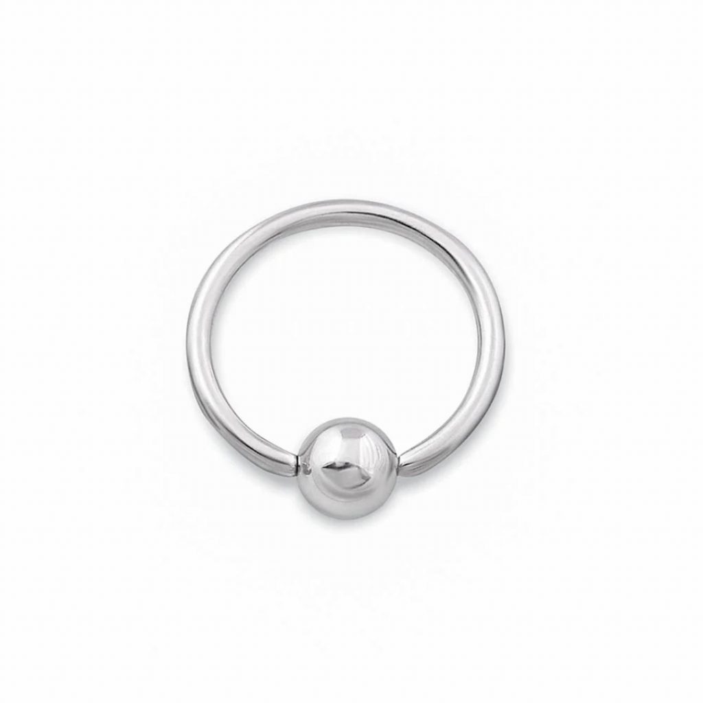 Close-up of a captive bead ring with a white background