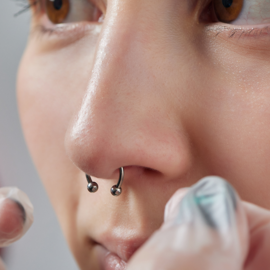 Close-up of septum piercing in a piercing client