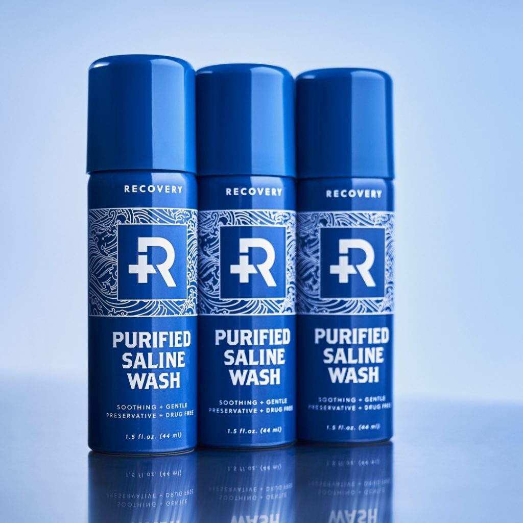 Three bottles of Recovery Purified Saline Wash.