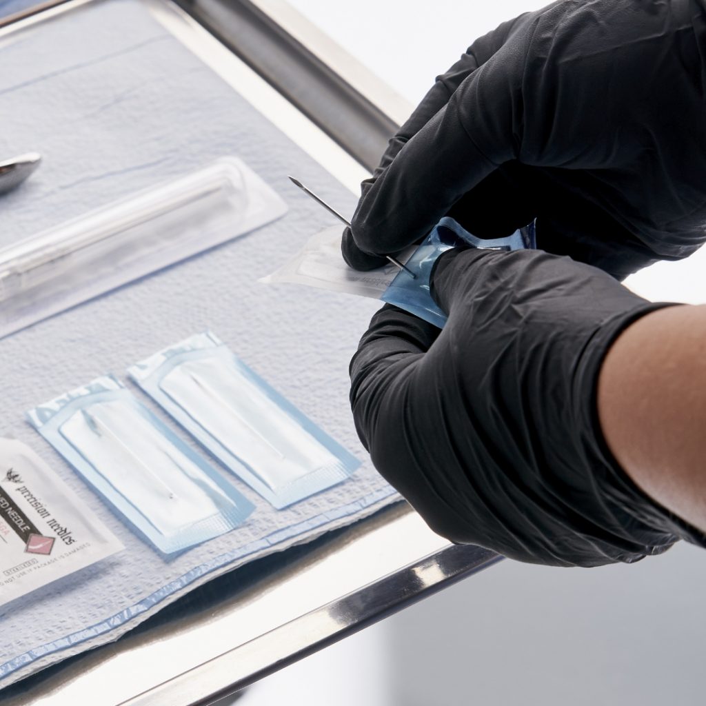 Close-up of medical tray full of piercing tools