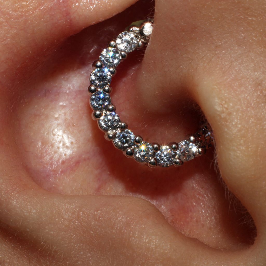 Close-up of a daith piercing