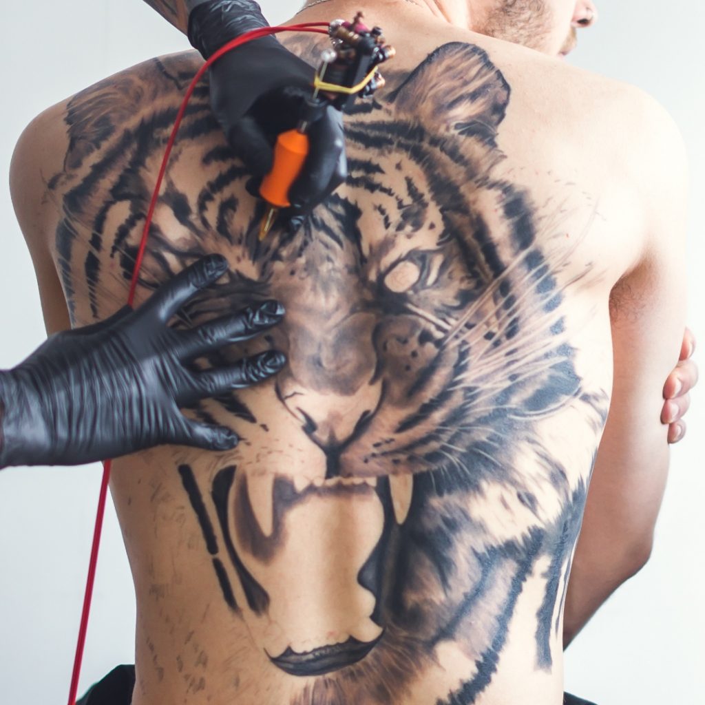 Full back panel tattoo in progress