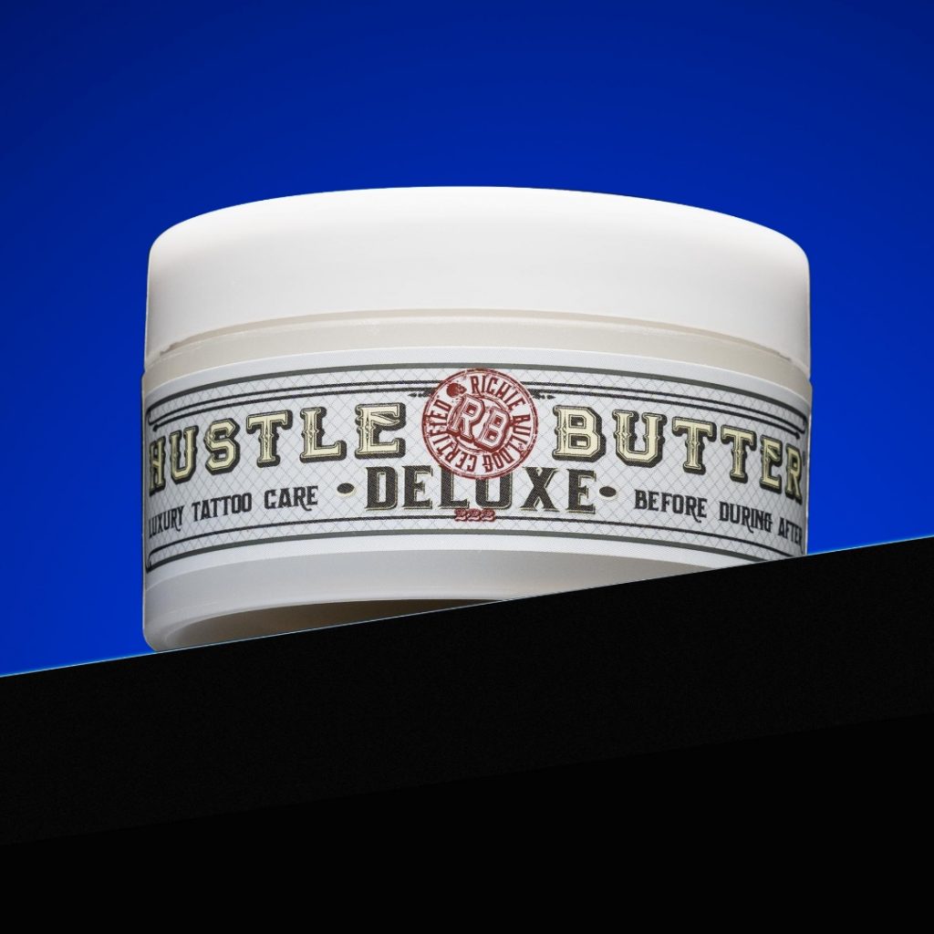 Hustle Butter Deluxe with a blue backdrop