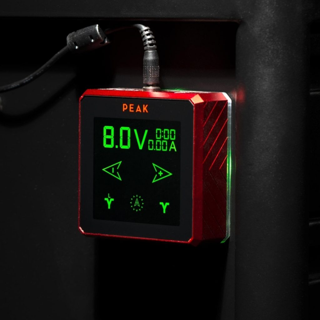 Close-up of Peak Vega tattoo power supply set to 8.,0v 