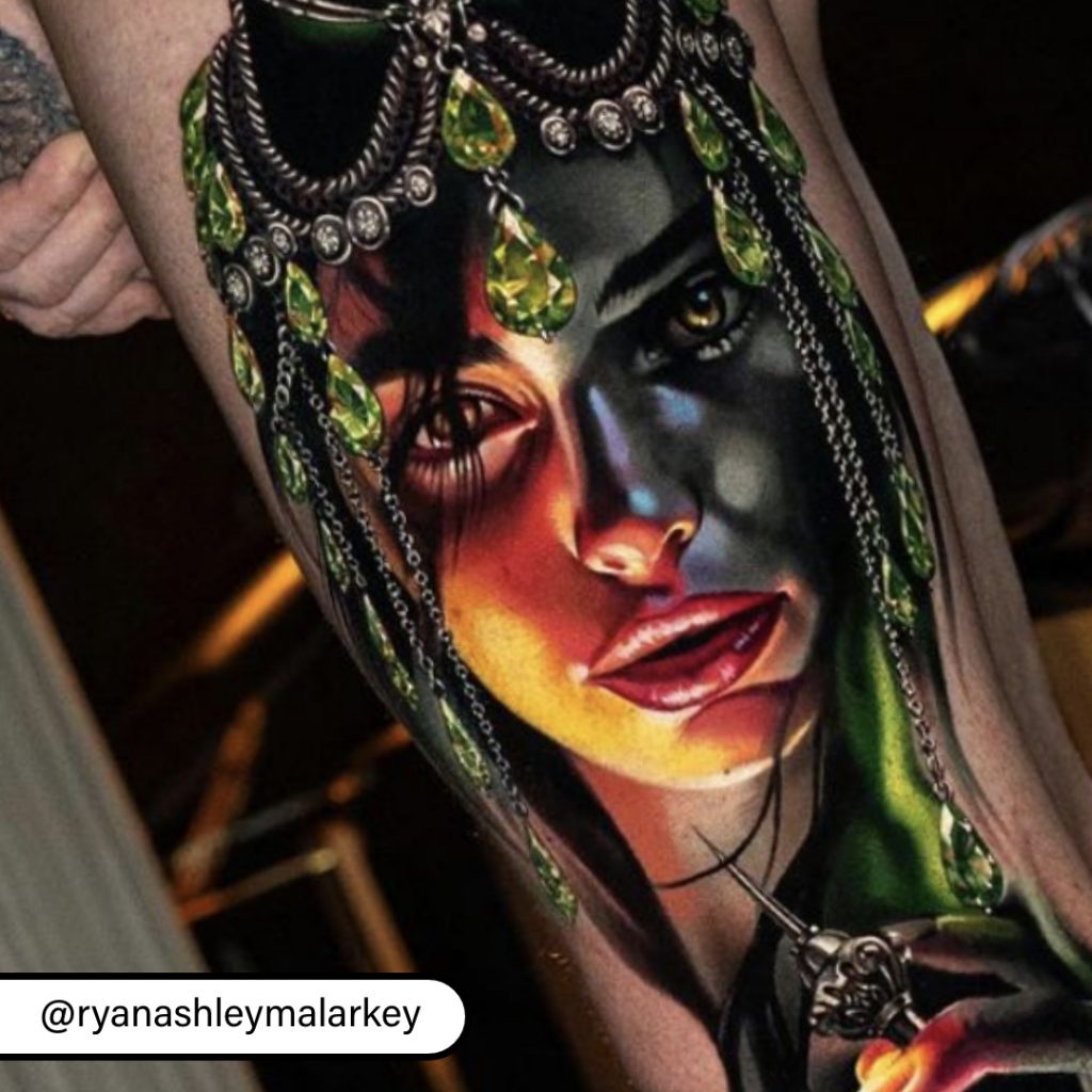 Close-up of portrait tattoo with jewel tattoo accents by Ryan Ashley Malarkey