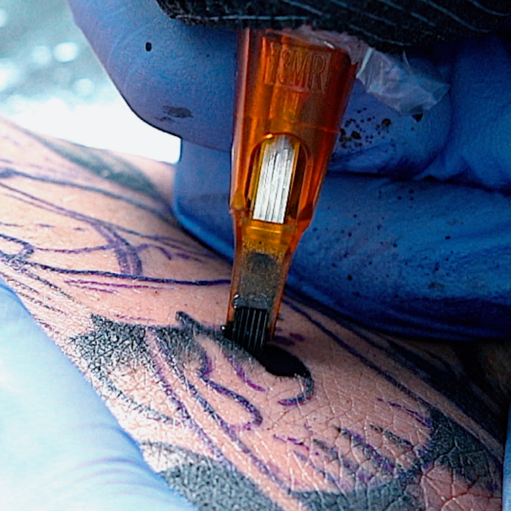 Closeup of tattoo artist shading a tattoo using Peak Triton cartridge