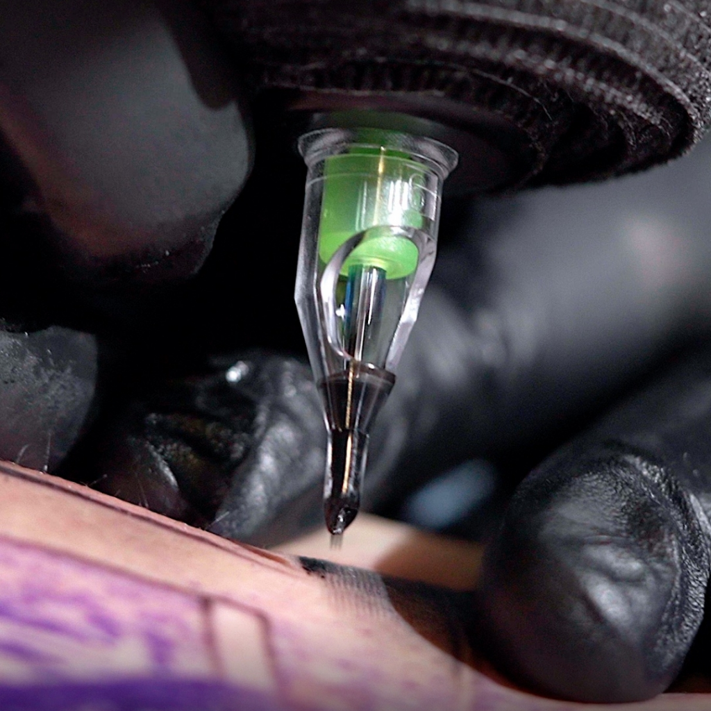 Closeup of tattoo artist shading with a Peak Stellar needle cartridge