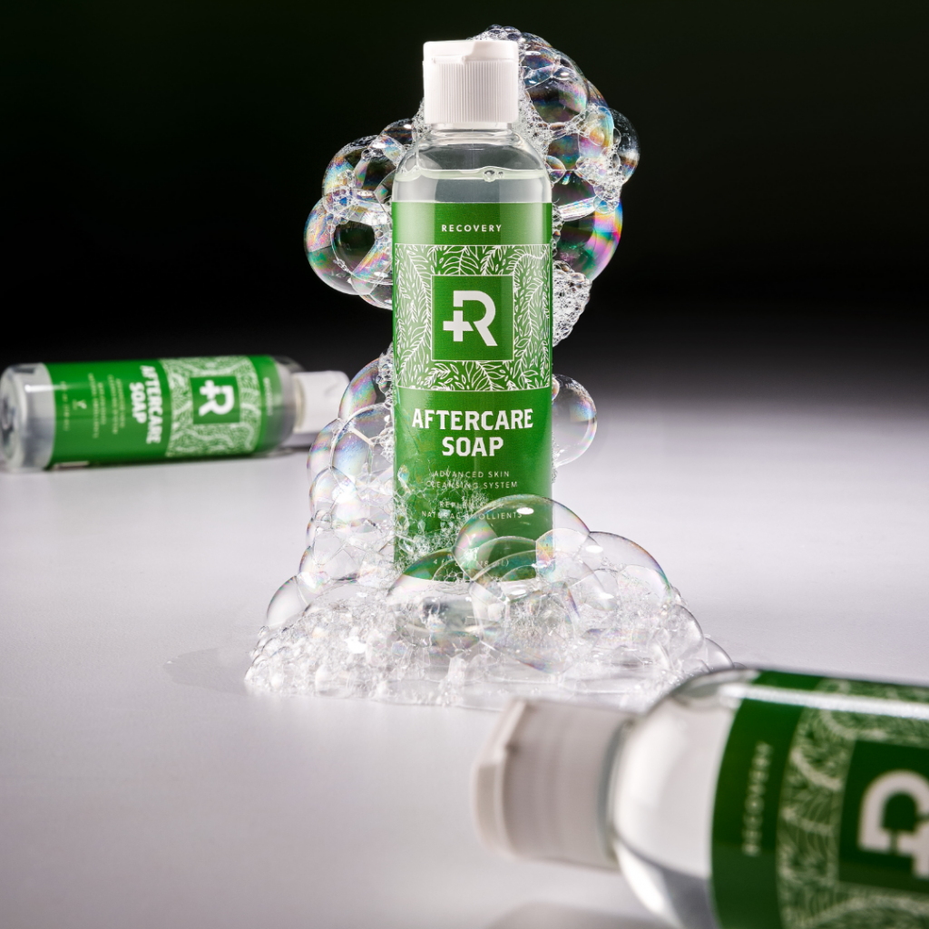 Recovery Aftercare Soap surrounded by bubbles.