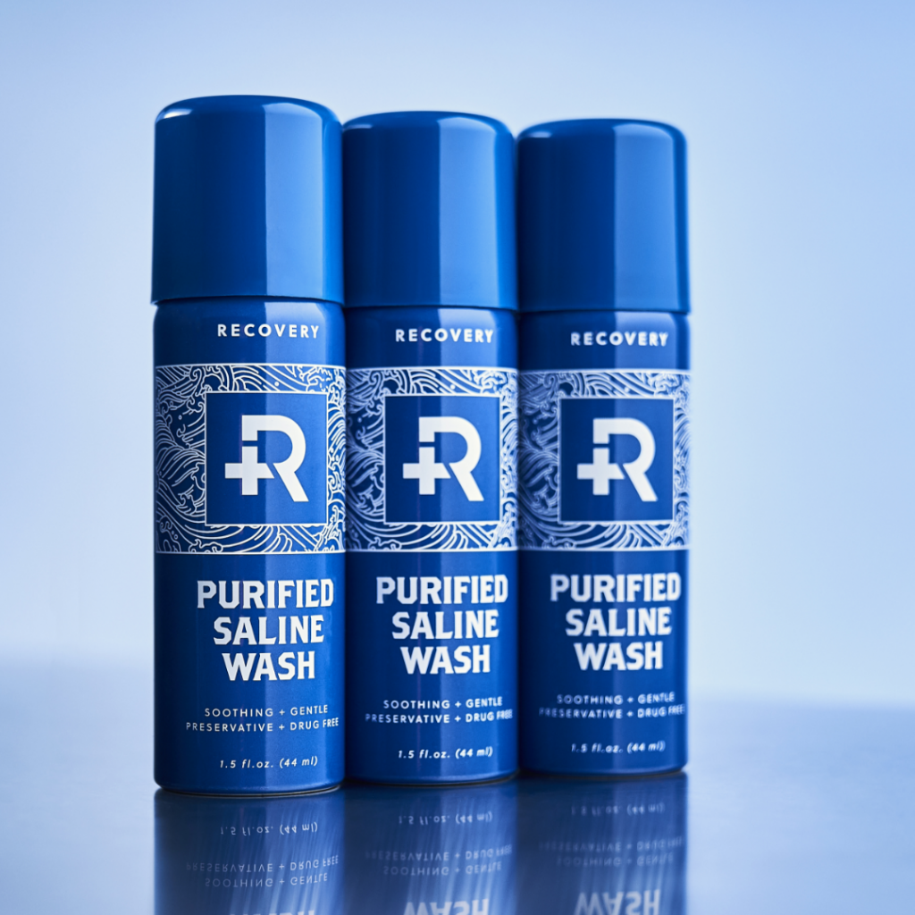 Three cans of Recovery Purified Saline Wash.