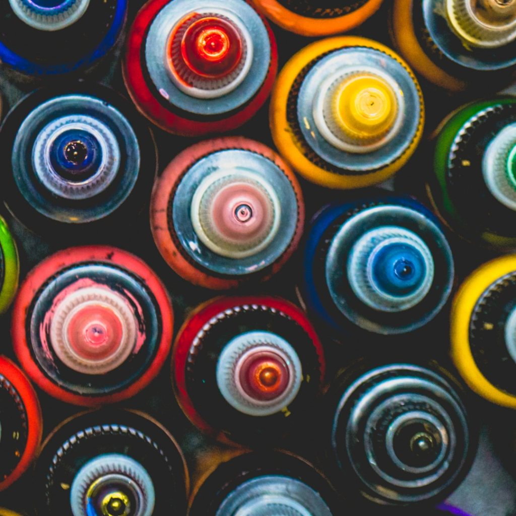 Overhead view of various tattoo ink bottles.