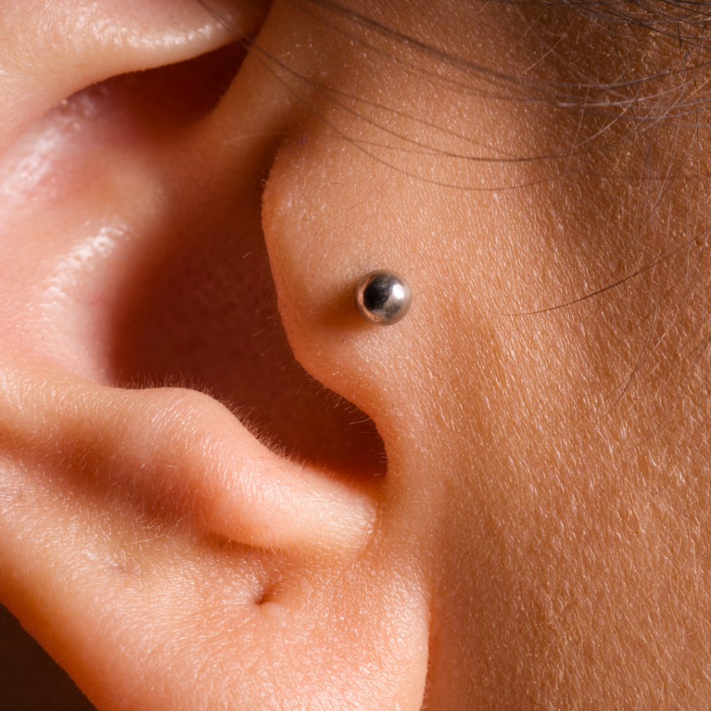A tragus piercing with a stud.